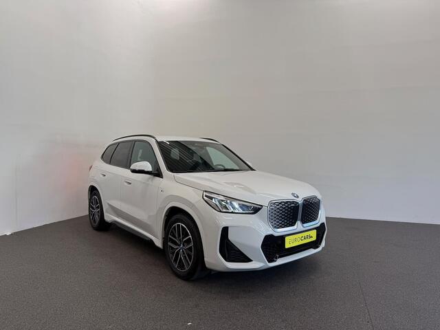 BMW iX1 eDrive20 67 kWh M Sport Edition 204pk Camera PDC Stoelverwarming Navi Hifi 18 inch M Velgen Adaptief M Onderstel