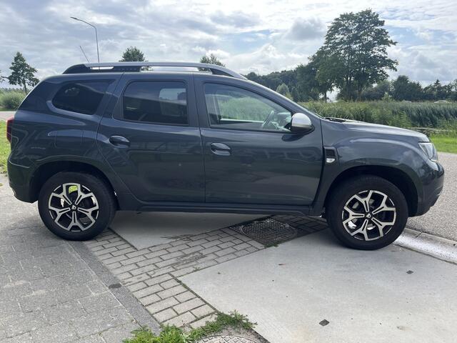 Dacia DUSTER 1.3 TCe 130 PK Prestige / Trekhaak / Apple Carplay - Android Auto / Camera / PDC V+A / 17'' LMV /