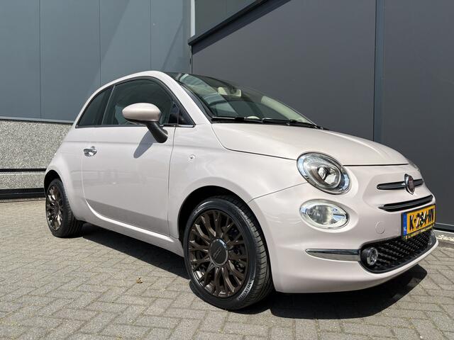 Fiat 500 1.2 Star Powder Pink Glazen panoramadak - Climate control - Parkeersensor achter - Cruise control - Mistlampen - Licht metalen velgen 16 inch - Bluetooth - Radio - Stuur multifunctioneel - Elektrische ramen - Lederen bekleding - Extra getint glas achter