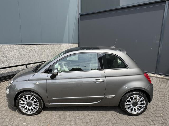 Fiat 500C 0.9 TwinAir Turbo Lounge Automaat Glazen panoramadak - Airco - Navigatie - Parkeersensor achter - Licht metalen velgen 15 inch - Cruise control - Mistlampen - Elektrische ramen - Stuur multifunctioneel - Bluetooth - Centrale vergrendeling met afstandsbedi
