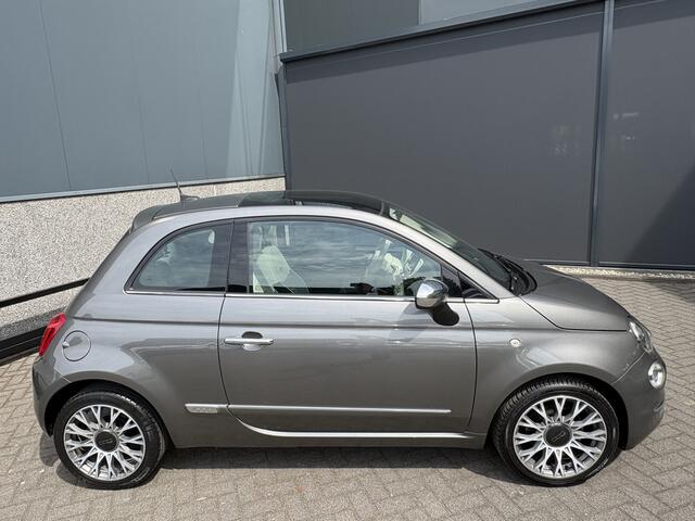 Fiat 500C 0.9 TwinAir Turbo Lounge Automaat Glazen panoramadak - Airco - Navigatie - Parkeersensor achter - Licht metalen velgen 15 inch - Cruise control - Mistlampen - Elektrische ramen - Stuur multifunctioneel - Bluetooth - Centrale vergrendeling met afstandsbedi