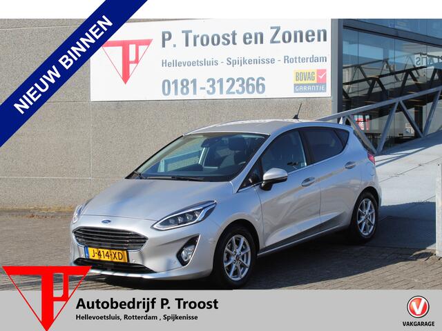 Ford FIESTA 1.0 EcoBoost Titanium Navigatie/Adaptive cruise control/Climate control/Lane assist/Apple carplay/Stoelverwarming/Stuurverwarming/Voorruitverwarming/Achteruitrijcamera/Parkeersensoren rondom/Dodehoek detectie/Keyless/Bluetooth/Lichtmetalen velgen.