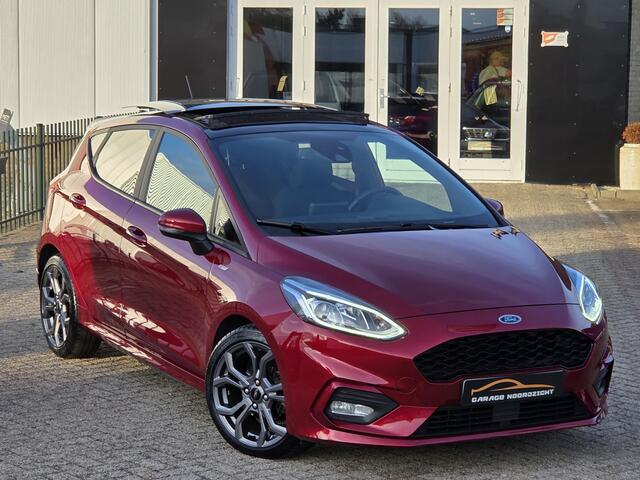 Ford FIESTA 1.0 EcoBoost ST-Line PANORAMADAK|NAVIGATIE|CRUISE CONTROL|B&O MUIZIEK|STOEL&STUUR VERWARMING|ECC/AIRCO|PDC ACHTER|17 INCH|DEALERE ONDERHOUDEN Maandag tot Vrijdag geopend van 09.00 tot 20.00 uur en Zaterdag van 09.00 tot 18.00 uur
