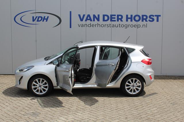 Ford FIESTA 1.0-100pk EcoBoost Titanium 5drs. Uiterst nette, luxe en zuinige Ford Fiesta. Voalautm. airco, Cruise control, Navigatie, LM wielen, Metallic lak, Parkeersensoren achter, Telefoonvoorb., Lane assist etc.