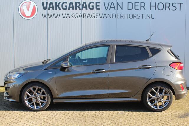 Ford FIESTA 1.0-125pk EcoBoost Mild-Hybrid ST-Line. Luxe, sportieve en goed onderhouden Fiesta ! Autm. airco, Cruise control, Lane assist, 17" Lmv, Parkeersensoren Achter, Metallic lak, Navigatie by Apple/Android, LED verlichting etc.