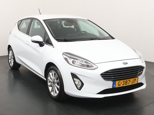 Ford FIESTA EcoBoost 100pk Titanium | Verwarmde voorruit | Camera | Navi | Cruise | All Season | Apple Carplay | Parkeersensoren |
