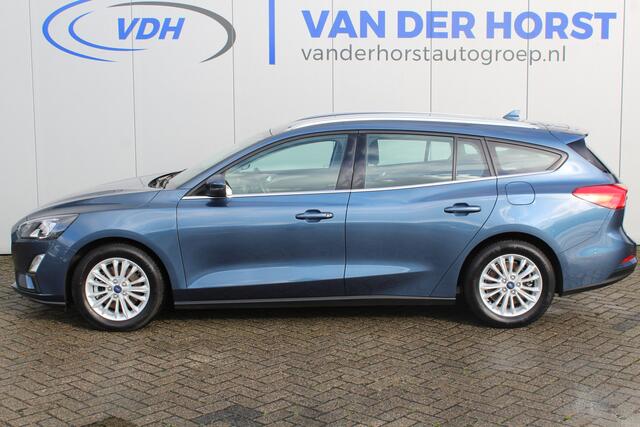 Ford FOCUS Wagon 1.0-125pk EcoBoost Mild-hybrid Titanium. Mooie, ruime, luxe en comfortabele Ford Focus wagon. Volautm. airco dual, camera, stoel-, stuur- en voorraamverw., easy entry/easy go, cruise control, Isofix, side- en lane assist, parkeersensoren v+a, LM wie