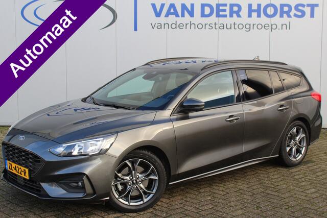 Ford FOCUS Wagon 1.0-125pk EcoBoost ST-Line AUTOMAAT ! Heel erg nette en goed onderhouden Ford Focus ST-Line wagon automaat. Volautm. airco dual, stoel-, stuur- en voorraamverw., camera, trekhaak, navigatie, telefoonvoorb., LM wln, cruise cntrl, skiluik etc., etc...