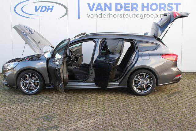 Ford FOCUS Wagon 1.0-125pk EcoBoost ST-Line AUTOMAAT ! Heel erg nette en goed onderhouden Ford Focus ST-Line wagon automaat. Volautm. airco dual, stoel-, stuur- en voorraamverw., camera, trekhaak, navigatie, telefoonvoorb., LM wln, cruise cntrl, skiluik etc., etc...