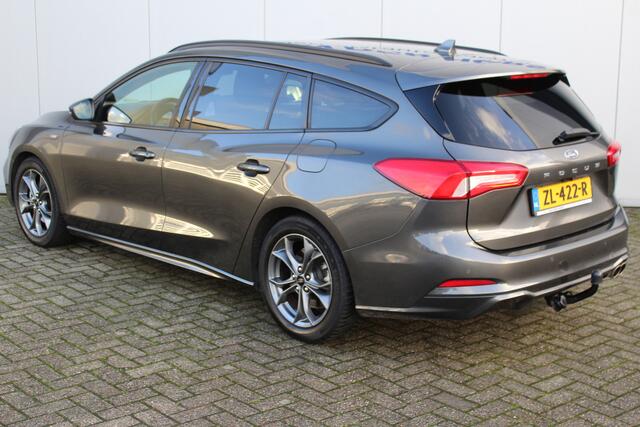 Ford FOCUS Wagon 1.0-125pk EcoBoost ST-Line AUTOMAAT ! Heel erg nette en goed onderhouden Ford Focus ST-Line wagon automaat. Volautm. airco dual, stoel-, stuur- en voorraamverw., camera, trekhaak, navigatie, telefoonvoorb., LM wln, cruise cntrl, skiluik etc., etc...
