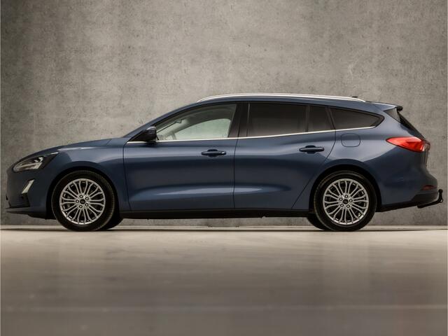 Ford FOCUS Wagon 1.0 EcoBoost Titanium Business Automaat (PANORAMADAK, APPLE CARPLAY, GROOT NAVI, STUUR/STOELVERWARMING, GETINT GLAS, ADAPTIVE CRUISE, TREKHAAK, PARKEER ASSISTENT, NIEUWE APK, NIEUWSTAAT)