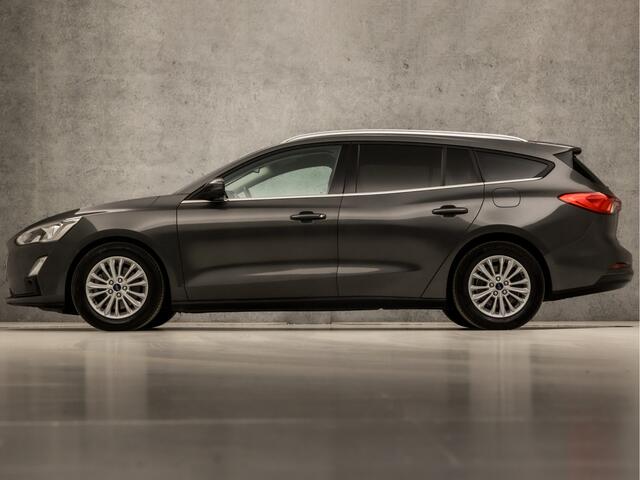 Ford FOCUS Wagon 1.0 EcoBoost Titanium (APPLE CARPLAY, GROOT NAVI, STUUR/STOELVERWARMING, ADAPTIVE CRUISE, SPORTSTOELEN, GETINT GLAS, CAMERA, LANE ASSIST, NIEUWSTAAT)