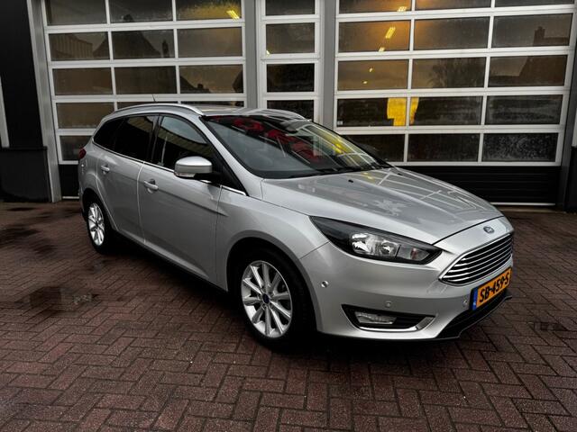 Ford FOCUS 1.0 TITANIUM / CAMERA / PDC / NAVI / CRUISE / LEER / STOEL-STUURVER.