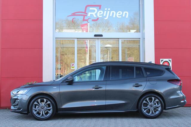 Ford FOCUS Wagon 1.0 155PK AUTOMAAT Hybrid ST LINE | ALL SEASON BANDEN | NAVIGATIE | DRAADLOZE APPLE CARPLAY/ANDROID AUTO | ADAPTIVE CRUISE CONTROL | LANE ASSIST | DODEHOEK DETECTIE | PARKEERSENSOREN VOOR + ACHTER | ACHTERUITRIJ CAMERA | LICHTMETALEN VELGEN 17" | DA