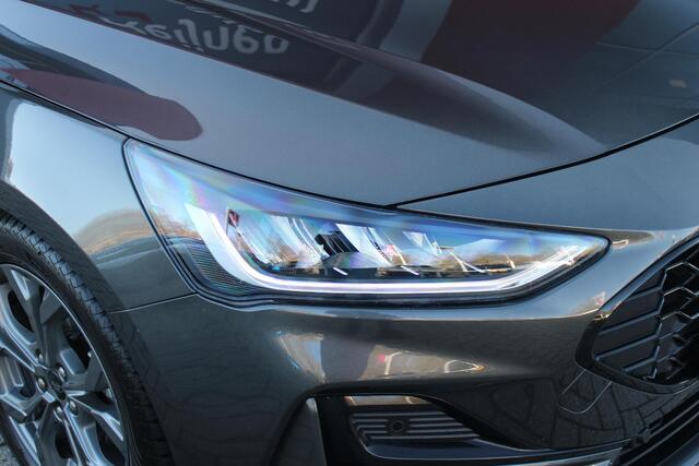 Ford FOCUS Wagon 1.0 155PK AUTOMAAT Hybrid ST LINE | ALL SEASON BANDEN | NAVIGATIE | DRAADLOZE APPLE CARPLAY/ANDROID AUTO | ADAPTIVE CRUISE CONTROL | LANE ASSIST | DODEHOEK DETECTIE | PARKEERSENSOREN VOOR + ACHTER | ACHTERUITRIJ CAMERA | LICHTMETALEN VELGEN 17" | DA