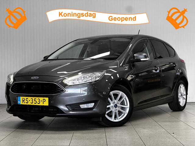 Ford FOCUS 1.0 Titanium/ Trekhaak/ 16'' LMV/ Camera/ Extra getint glas/ Apple + Android/ Navi/ Clima/ Cruise/ Elek. pakket/ Bluetooth/ Armsteun/ Multi. LEDER. Stuur/ Mistl./ PDC V+A.