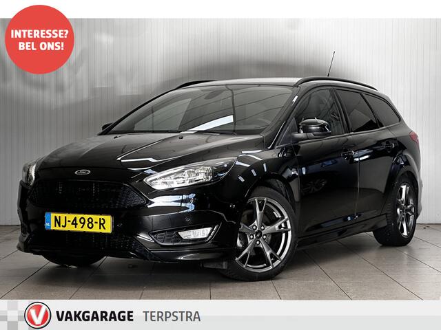 Ford FOCUS Wagon 1.0 ST-Line!/ Trekhaak/ 17'' LMV/ Apple + Android/ Navi/ Clima/ Cruise/ Elek. pakket/ Isofix/ Bluetooth/ Armsteun/ Multi. LEDER. Stuur/ Mistl./ PDC V+A/ Extra getint glas.