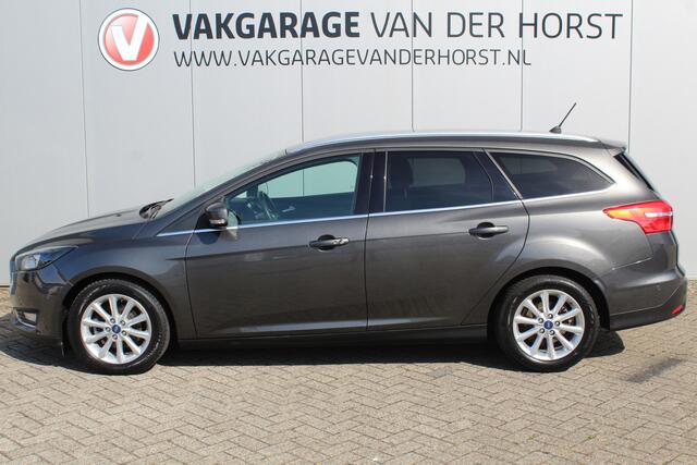 Ford FOCUS Wagon 1.0-125pk Titanium. Zeer nette, praktische en goed onderhouden wagen, afkomstig van de 1e eig. ! Autm. airco dual, cruise control, trekhaak, verwarmd voorraam, navigatie, telefoonvoorb., metallic lak, pdc v~a, LM wielen, All Season banden etc.