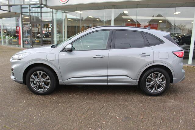 Ford KUGA 2.5-225pk PHEV ST-Line X. 1500kg Trekgewicht Hybride rijden voor een reëel bedrag ! Autm. airco dual, stuur-, stoel-, achterbank- en voorraamverw., keyless entry/keyless go, privacy glass, camera v+a, side- en lane assist, adaptieve cruise cntrl, trekhaak