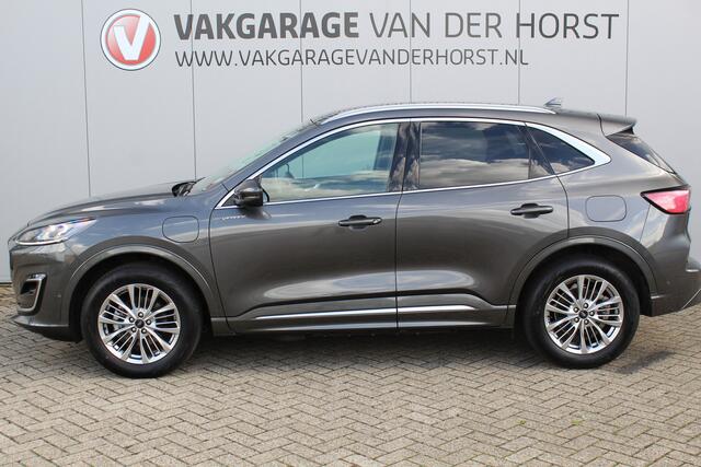 Ford KUGA 2.5-225pk PHEV Vignale. In uiterst nette staat verkerende Ford Kuga in de zeer chique Vignale uitvoering met slechts 23.000km ! Adapt. cruise cntrl, side- en lane assist, trekhaak, head-up display, B&O soundsyst., lederen int., stuur-, stoel-, achterbank- en voorraamverw. etc.