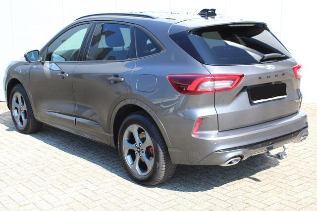 Ford KUGA 2.5-243pk PHEV ST-Line X. Febr. 2026, slechts 8.400km ! Autm. airco dual, elektr. panodak, elektr. trekhaak, elektr. achterklep, leer/alcantara, klep, LED verl., navigatie, telefoonvoorb., stoel-, stuur-, voorraam- en achterbankverw., side- en lan