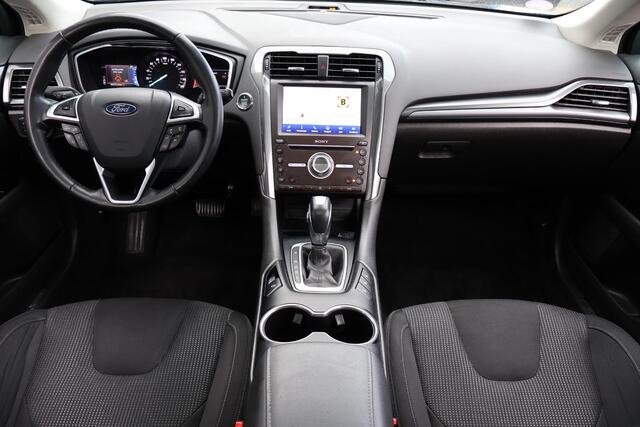 Ford MONDEO Wagon 2.0 IVCT HEV Titanium 1e Eigenaar | Volledig Onderh | BTW | PANO | Sfeer | Camera | Trekhaak | Stoelverwarming | Elek Klep | Ad Cruise | Keyless | Full Led | Navi | PDC | DAB Radio