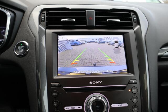 Ford MONDEO Wagon 2.0 IVCT HEV Titanium 1e Eigenaar | Volledig Onderh | BTW | PANO | Sfeer | Camera | Trekhaak | Stoelverwarming | Elek Klep | Ad Cruise | Keyless | Full Led | Navi | PDC | DAB Radio