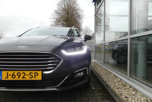 Ford MONDEO Wagon 2.0 IVCT HEV Titanium ELEKT. TREKHAAK (750KG), WINTER PACK, MEMORY, CRUISE, CLIMA, NAVI, CAMERA, PDC V&A, APPLE CARPLAY/ANDROID AUTO, BLIS, KEYLESS, ELEKT. PASSAGIERSSTOEL, ELEKT. ACHTERKLEP, ADAPTIEVE KOPLAMPEN, LANE ASSIST, 57.812KM
