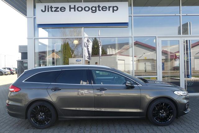 Ford MONDEO Wagon 2.0 IVCT HEV Titanium 18 INCH, ELEKT. TREKHAAK (750KG), WINTER PACK, MEMORY, CRUISE, CLIMA, NAVI, CAMERA, PDC V&A, APPLE CARPLAY/ANDROID AUTO, BLIS, KEYLESS, ELEKT. PASSAGIERSSTOEL, ELEKT. ACHTERKLEP, ADAPTIEVE KOPLAMPEN, LANE ASSIST, 57.812KM