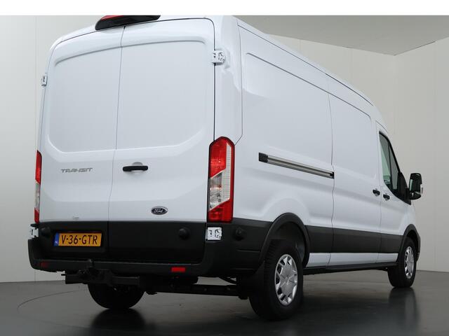 Ford TRANSIT 350 2.0 TDCI L3H2 Trend Navigatie | Stoelverwarming | Trekhaak 2500 KG AHW | Airco | 3-Zits | NIEUW | Carplay - Android Auto | Laadruimte Pakket | Cruise Control | Multifuntioneel Stuurwiel