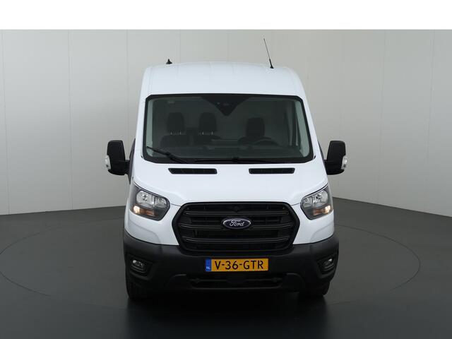Ford TRANSIT 350 2.0 TDCI L3H2 Trend Navigatie | Stoelverwarming | Trekhaak 2500 KG AHW | Airco | 3-Zits | NIEUW | Carplay - Android Auto | Laadruimte Pakket | Cruise Control | Multifuntioneel Stuurwiel