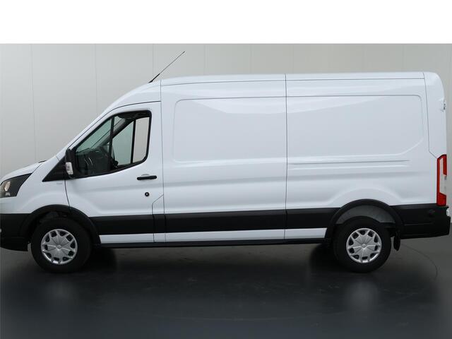 Ford TRANSIT 350 2.0 TDCI L3 H2 Trend Navigatie | Stoelverwarming | Trekhaak 2500 KG AHW | Airco | 3-Zits | NIEUW | Carplay - Android Auto | Laadruimte Pakket | Cruise Control | Multifuntioneel Stuurwiel