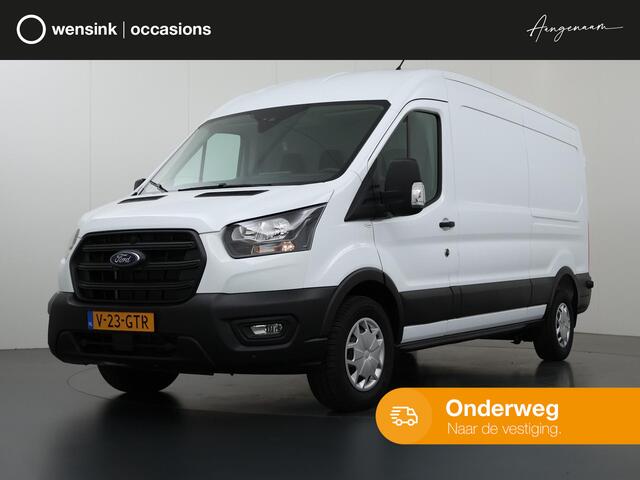 Ford TRANSIT 350 2.0 TDCI L3 H2 Trend Navigatie | Stoelverwarming | Trekhaak 2500 KG AHW | Airco | 3-Zits | NIEUW | Carplay - Android Auto | Laadruimte Pakket | Cruise Control | Multifuntioneel Stuurwiel
