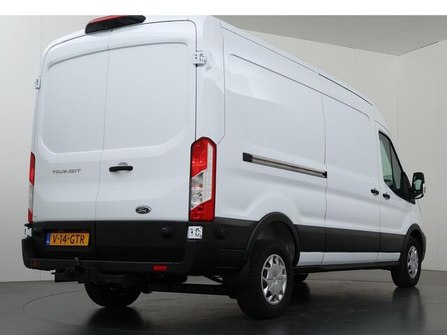 Ford TRANSIT 350 2.0 TDCI | L3 H2 | Trend | Navigatie | Stoelverwarming | Trekhaak 2500 KG AHW | Airco | 3-Zits | NIEUW | Carplay - Android Auto | Laadruimte Pakket | Cruise Control | Multifuntioneel Stuurwiel