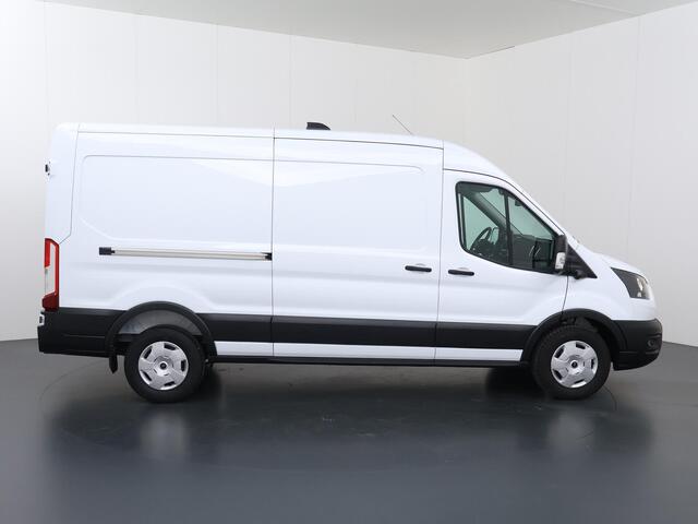 Ford TRANSIT 350 2.0 TDCI | L3 H2 | TREND | ADAPTIEVE CRUISE | STOELVERWARMING | TREKHAAK | STUURWIELVERWARMING | CAMERA | PARKEERSENSOREN | NAVIGATIE | CARPLAY / ANDROID AUTO | BLIND SPOT | INKLAPBARE SPIEGELS
