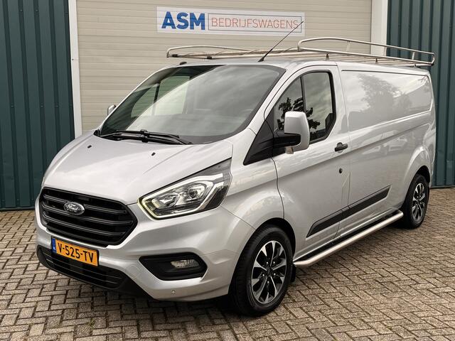 Ford TRANSIT CUSTOM 300 2.0 131Pk TDCI L2H1 Trend / Cruise / Airco / Navi / IMPERIAAL / Trekhaak / Lease ¤393,-pm / Apk t/m 25-04-2025