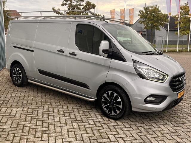 Ford TRANSIT CUSTOM 300 2.0 131Pk TDCI L2H1 Trend / Cruise / Airco / Navi / IMPERIAAL / Trekhaak / Lease ¤393,-pm / Apk t/m 25-04-2025