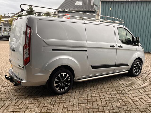 Ford TRANSIT CUSTOM 300 2.0 131Pk TDCI L2H1 Trend / Cruise / Airco / Navi / IMPERIAAL / Trekhaak / Lease ¤393,-pm / Apk t/m 25-04-2025