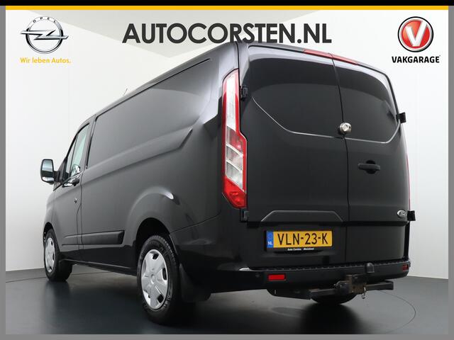 Ford TRANSIT CUSTOM 2.0D 130PK L1H1 3pers. Airco PDC-a+v Trekhaak Cruise-Controle voorruit verwarmbaar Betonplex Schuifdeur-r Tussenwand voorruit verwarmbaar Led Bumpers+Spiegels-in-kleur Trend Elektr.Ramen+Spiegels+Verwarmd Centr.vergr+afst.b.320 2.0 TDCI Adaptieve bochtver