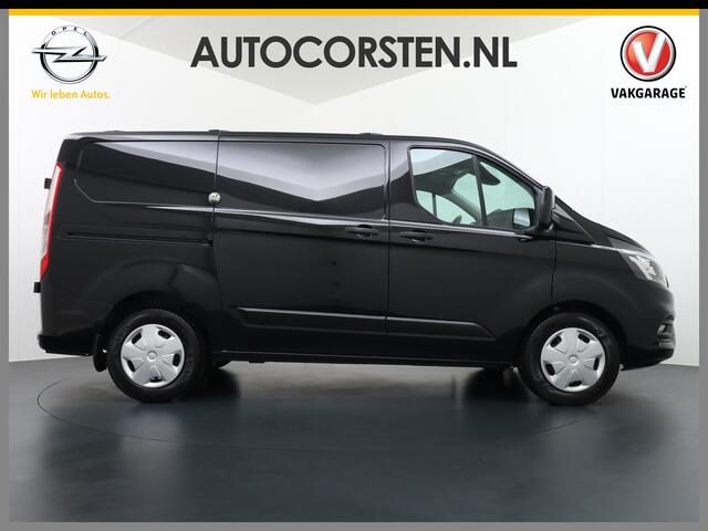 Ford TRANSIT CUSTOM 2.0D 130PK L1H1 3pers. Airco PDC-a+v Trekhaak Cruise-Controle voorruit verwarmbaar Betonplex Schuifdeur-r Tussenwand voorruit verwarmbaar Led Bumpers+Spiegels-in-kleur Trend Elektr.Ramen+Spiegels+Verwarmd Centr.vergr+afst.b.320 2.0 TDCI Adaptieve bochtver
