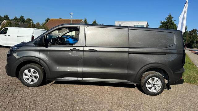 Ford TRANSIT CUSTOM 320 2.0 TDCI L2H1 Trend Automaat 136pk | Adaptive cruise control | 8-weg bestuurderstoel + passagiersbank| Stoelverwarming | Dodehoeksensoren | Navigatie | Elektrische inklapbare spiegels | 16 inch lichtmetalen velgen | Full LED | Dual-zone climate contr
