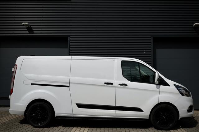 Ford TRANSIT CUSTOM 340 2.0 TDCI L2H1 | L+R Schuifdeur | Navigatie | Blind Spot | CarPlay | Camera | Standkachel | Trekhaak | 3-Zitter | Nieuwe APK | Onderhoudsbeurt