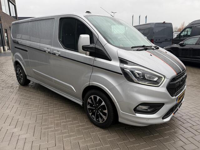 Ford TRANSIT CUSTOM 320 2.0 TDCI L2H1 Sport | Automaat 185pk | Camera | Bi-Xenon | Trekhaak | Stoelverwarming | Betimmering + Vloer | Raptor Grille