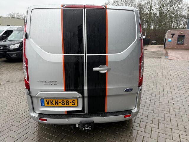 Ford TRANSIT CUSTOM 320 2.0 TDCI L2H1 Sport | Automaat 185pk | Camera | Bi-Xenon | Trekhaak | Stoelverwarming | Betimmering + Vloer | Raptor Grille