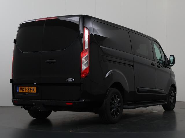 Ford TRANSIT CUSTOM 320 2.0 TDCI | Aut. | L2 H1 | Platinum | DC | Lederen bekleding | 5-zits | Navigatie | Stoelverwarming | Parkeercamera | LM Velgen | Treeplanken |