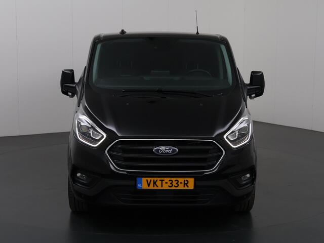 Ford TRANSIT CUSTOM 320 2.0 TDCI | Aut. | L2 H1 | Platinum | DC | Lederen bekleding | 5-zits | Navigatie | Stoelverwarming | Parkeercamera | LM Velgen | Treeplanken |