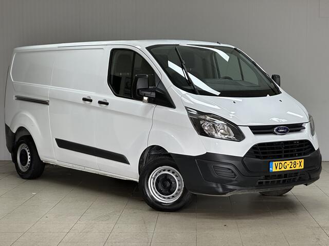 Ford TRANSIT CUSTOM 290 2.0 TDCI L2H1 Ambiente/ 3-Zitplaatsen voor!/ Trekhaak/ Zij-Schuifdeur rechts/ Airco/ Elek. pakket/ Bluetooth/ Armsteun/ Multi. Stuur/ AUX & USB/ Dagrijverl.