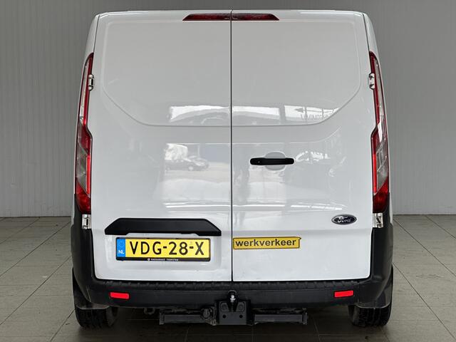 Ford TRANSIT CUSTOM 290 2.0 TDCI L2H1 Ambiente/ 3-Zitplaatsen voor!/ Trekhaak/ Zij-Schuifdeur rechts/ Airco/ Elek. pakket/ Bluetooth/ Armsteun/ Multi. Stuur/ AUX & USB/ Dagrijverl.
