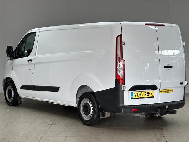 Ford TRANSIT CUSTOM 290 2.0 TDCI L2H1 Ambiente/ 3-Zitplaatsen voor!/ Trekhaak/ Zij-Schuifdeur rechts/ Airco/ Elek. pakket/ Bluetooth/ Armsteun/ Multi. Stuur/ AUX & USB/ Dagrijverl.