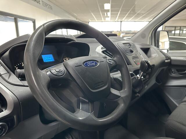 Ford TRANSIT CUSTOM 290 2.0 TDCI L2H1 Ambiente/ 3-Zitplaatsen voor!/ Trekhaak/ Zij-Schuifdeur rechts/ Airco/ Elek. pakket/ Bluetooth/ Armsteun/ Multi. Stuur/ AUX & USB/ Dagrijverl.